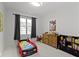Comfortable bedroom with playful decor, including a car-shaped bed and ample storage, designed for fun and organization at 17359 Wilkes Way, Westfield, IN 46074