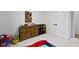 bedroom with wooden dresser, twin bed, and playful decor at 17359 Wilkes Way, Westfield, IN 46074