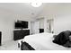Spacious bedroom with a dresser and TV, complete with plush carpeting at 17359 Wilkes Way, Westfield, IN 46074