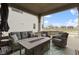 Inviting covered porch with stylish seating, a fire table, and ample space for outdoor relaxation and entertainment at 17359 Wilkes Way, Westfield, IN 46074