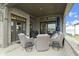 Relaxing covered porch with comfortable seating, an outdoor rug, and views of the lush surroundings at 17359 Wilkes Way, Westfield, IN 46074