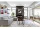 Bright living room featuring fireplace, large sectional sofa, and sliding glass doors to patio at 17359 Wilkes Way, Westfield, IN 46074