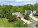 Beautiful home with manicured lawn, mature trees, and a paved driveway in a quiet neighborhood at 18278 Benton Oak Dr, Noblesville, IN 46062