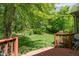 Relaxing backyard with a wooden deck, mature trees and a tranquil setting at 18278 Benton Oak Dr, Noblesville, IN 46062