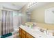 Well-lit bathroom featuring double sinks with a large mirror, cabinet space and modern fixtures at 18278 Benton Oak Dr, Noblesville, IN 46062