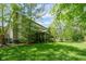 Spacious home with well-maintained lawn, screened porch, and a wooden deck at 18278 Benton Oak Dr, Noblesville, IN 46062