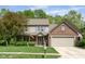 Charming two-story home with brick accents, attached garage and well-manicured lawn at 18278 Benton Oak Dr, Noblesville, IN 46062