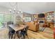 Open concept living room, dining area, and fireplace with built-in shelving at 18278 Benton Oak Dr, Noblesville, IN 46062