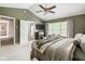 Beautiful main bedroom showcasing vaulted ceilings, carpeted floors and access to the en suite at 18278 Benton Oak Dr, Noblesville, IN 46062