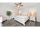 Bright bedroom with a comfortable white bed, matching nightstands, and a ceiling fan for added comfort at 217 N Liberty Blvd, Mooresville, IN 46158
