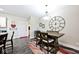 Charming dining area with a wooden table set, accent rug, and a decorative oversized clock on the wall at 217 N Liberty Blvd, Mooresville, IN 46158