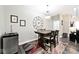 Cozy dining area featuring a wood table with chairs, an accent rug, and a stylish beverage cooler at 217 N Liberty Blvd, Mooresville, IN 46158