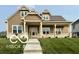 Charming home with a covered front porch and beautifully landscaped front yard at 217 N Liberty Blvd, Mooresville, IN 46158