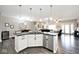 Open-concept kitchen with a central island and modern appliances, perfect for cooking and entertaining at 217 N Liberty Blvd, Mooresville, IN 46158