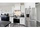Modern kitchen featuring stainless steel appliances, sleek white cabinets, and a functional layout at 217 N Liberty Blvd, Mooresville, IN 46158