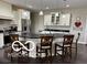 Bright kitchen with a large island, pendant lighting, and stainless steel appliances at 217 N Liberty Blvd, Mooresville, IN 46158