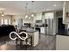 Kitchen with island seating, stainless appliances, and abundant counter space at 217 N Liberty Blvd, Mooresville, IN 46158