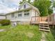 Back of house featuring deck, side yard, and lots of yard space at 2528 S Pennsylvania St, Indianapolis, IN 46225