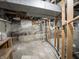 Unfinished basement with concrete flooring and exposed utilities at 2528 S Pennsylvania St, Indianapolis, IN 46225
