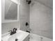 An expertly tiled bathroom with a dark, rainfall shower head at 2528 S Pennsylvania St, Indianapolis, IN 46225