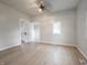 This bedroom features new floors, neutral paint, a window, and decorative doors at 2528 S Pennsylvania St, Indianapolis, IN 46225