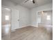Light-filled bedroom featuring wood-look floors, a window, and neutral paint at 2528 S Pennsylvania St, Indianapolis, IN 46225