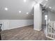 Spacious bonus room featuring neutral walls and wood-look laminate flooring at 2528 S Pennsylvania St, Indianapolis, IN 46225