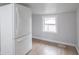 A view of the refrigerator and a window providing natural light in the kitchen area at 2528 S Pennsylvania St, Indianapolis, IN 46225