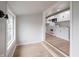 Bright kitchen featuring white cabinets, modern appliances, and stylish wood flooring at 2528 S Pennsylvania St, Indianapolis, IN 46225