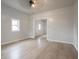A bright and airy living room boasts new floors, neutral paint, modern lighting, and an open doorway at 2528 S Pennsylvania St, Indianapolis, IN 46225
