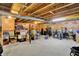 Spacious unfinished basement with exposed ceiling, providing ample storage and potential for renovations at 2623 Senators Way, Indianapolis, IN 46217