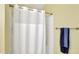 Bright bathroom features a shower with white shower curtain and silver hardware at 2623 Senators Way, Indianapolis, IN 46217