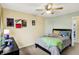 Cozy bedroom with neutral walls, ceiling fan, and large bed offers a relaxing retreat at 2623 Senators Way, Indianapolis, IN 46217
