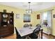 Inviting dining room with hardwood floors and modern light fixture perfect for Gathering meals and entertaining guests at 2623 Senators Way, Indianapolis, IN 46217
