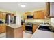 Practical kitchen with stainless steel appliances, a functional island, and ample counter space at 2623 Senators Way, Indianapolis, IN 46217