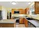 Well-maintained kitchen with stainless steel appliances, ample wood cabinetry and countertop workspace at 2623 Senators Way, Indianapolis, IN 46217