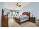 Spacious main bedroom with a vaulted ceiling, ceiling fan, and large windows at 2623 Senators Way, Indianapolis, IN 46217