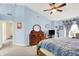 Comfortable main bedroom with a vaulted ceiling, ceiling fan, and an adjacent sitting area at 2623 Senators Way, Indianapolis, IN 46217