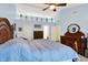 Bright main bedroom with vaulted ceiling, ceiling fan, and built-in shelving along the top of the walls at 2623 Senators Way, Indianapolis, IN 46217