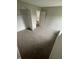 Neutral bedroom with carpet, closet with shelving, and bathroom located through door at 2717 N Rural St, Indianapolis, IN 46218