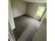 Bedroom boasts neutral walls and carpet, with an exterior view from the window at 2717 N Rural St, Indianapolis, IN 46218