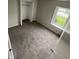 Cozy bedroom with a window, closet, and plush brown carpet, creating a relaxing space at 2717 N Rural St, Indianapolis, IN 46218