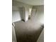 Bedroom boasts neutral walls and carpet with closet; bathroom located through door at 2717 N Rural St, Indianapolis, IN 46218