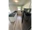Modern kitchen boasting white cabinets, black countertops, and stainless-steel appliances at 2717 N Rural St, Indianapolis, IN 46218