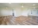 Bright and airy living room with wood-look flooring, recessed lighting, and neutral walls at 2721 W 34Th St, Anderson, IN 46011
