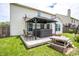 Relaxing backyard with a wooden deck, hot tub under a gazebo, and outdoor seating at 2730 Foxbriar Pl, Indianapolis, IN 46203