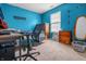 Blue bedroom with a work desk, chair, bed, and light carpet at 2730 Foxbriar Pl, Indianapolis, IN 46203