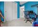 Blue bedroom featuring a desk, a chair, and a closet at 2730 Foxbriar Pl, Indianapolis, IN 46203