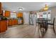 Spacious kitchen with wooden cabinets, stainless steel appliances, and laminate flooring at 2730 Foxbriar Pl, Indianapolis, IN 46203