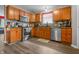 Well-appointed kitchen with stainless steel appliances, wood cabinets, and backsplash at 2730 Foxbriar Pl, Indianapolis, IN 46203